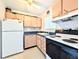 Kitchen featuring dated cabinetry, updated appliances, and a window for lots of light at 5951 Todd St # D37, Bradenton, FL 34207