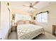 Charming bedroom features a bed, ceiling fan, and natural light at 5951 Todd St # D37, Bradenton, FL 34207