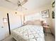Another view of the bedroom with a bed, ceiling fan, and natural light at 5951 Todd St # D37, Bradenton, FL 34207
