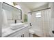 Modern bathroom with white vanity, vessel sink, black fixtures, and shower/tub combo at 624 Fort Duquesna Dr, Sun City Center, FL 33573