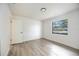 Cozy bedroom with modern floors and window with natural light, with a closet at 624 Fort Duquesna Dr, Sun City Center, FL 33573