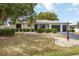 Well-maintained single-story home showcasing a manicured lawn and a convenient two-car garage at 624 Fort Duquesna Dr, Sun City Center, FL 33573