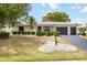 Charming single story home boasts a two car garage and meticulously manicured landscaping at 624 Fort Duquesna Dr, Sun City Center, FL 33573