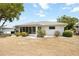 Exterior view of a bright home with large, screened windows and a neutral color palette, perfect for relaxation at 624 Fort Duquesna Dr, Sun City Center, FL 33573