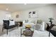 Open living room with contemporary furniture, chic decor, and recessed lighting at 624 Fort Duquesna Dr, Sun City Center, FL 33573