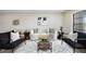 Beautiful living room showcases stylish decor, white sofa, and modern black armchairs at 624 Fort Duquesna Dr, Sun City Center, FL 33573