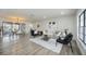 Inviting living room leads to an adjacent dining area and features modern floors and design at 624 Fort Duquesna Dr, Sun City Center, FL 33573