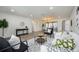 Open living space showcases updated floors, modern furnishings, and lots of natural light at 624 Fort Duquesna Dr, Sun City Center, FL 33573
