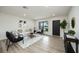 Bright living room offers updated floors, modern furnishings, and an open, airy feel at 624 Fort Duquesna Dr, Sun City Center, FL 33573
