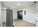 Spacious utility room with modern floors, water heater, storage and closet at 624 Fort Duquesna Dr, Sun City Center, FL 33573