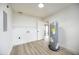 Spacious utility room has modern floors, a water heater, storage shelving, and closet at 624 Fort Duquesna Dr, Sun City Center, FL 33573