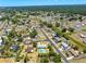 Aerial view of a residential property featuring a refreshing pool, located in a tranquil and well-planned community at 6698 Acmar Ct, North Port, FL 34287