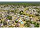 Aerial view of a property boasting a private pool, located on a corner lot within a serene neighborhood at 6698 Acmar Ct, North Port, FL 34287