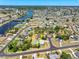 Aerial view of a property with a pool, situated near the river and other neighborhood amenities at 6698 Acmar Ct, North Port, FL 34287