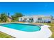 A large backyard with a pool and patio offers ample space for outdoor enjoyment and entertaining at 6698 Acmar Ct, North Port, FL 34287