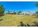 Expansive backyard featuring a sparkling pool, patio area, and lush green lawn, perfect for outdoor living and entertainment at 6698 Acmar Ct, North Port, FL 34287