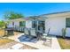 Relax on the patio or grill in the backyard, completing outdoor living with pavers and landscaping at 6698 Acmar Ct, North Port, FL 34287