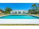 Enjoy outdoor living in this backyard, featuring a sparkling pool and patio for relaxation and entertainment at 6698 Acmar Ct, North Port, FL 34287