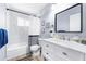 Bathroom featuring white vanity, commode, and shower with tub combo at 6698 Acmar Ct, North Port, FL 34287