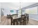 Open concept dining and living area with lots of natural light at 6698 Acmar Ct, North Port, FL 34287