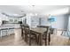 Bright dining area adjacent to kitchen and living room, ideal for entertaining at 6698 Acmar Ct, North Port, FL 34287