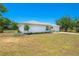 This home features a lovely garden with lush plantings complementing its well-maintained exterior, enhancing its curb appeal at 6698 Acmar Ct, North Port, FL 34287
