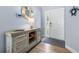 Inviting foyer with stylish coastal-themed decor and a decorative console table at 6698 Acmar Ct, North Port, FL 34287