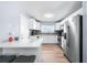 Modern kitchen featuring stainless steel appliances and an eat-in counter at 6698 Acmar Ct, North Port, FL 34287