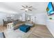 Open-concept living room with beachy decor and modern furniture at 6698 Acmar Ct, North Port, FL 34287