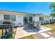 This home boasts a cozy backyard patio with a grill, perfect for summer barbecues and relaxation at 6698 Acmar Ct, North Port, FL 34287