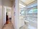 Bathroom with a tub-shower combo, vanity, and neutral color palette at 6924 Cumberland Ter, University Park, FL 34201