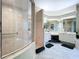 Spacious primary bathroom with a glass shower, double vanity, and makeup area at 6924 Cumberland Ter, University Park, FL 34201