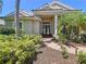 Inviting front entrance with double doors, manicured landscaping, and a brick walkway, adding to the home's charm at 6924 Cumberland Ter, Bradenton, FL 34201