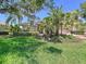 Lovely single-Gathering home with lush green lawn, mature trees, and well-maintained landscaping at 6924 Cumberland Ter, University Park, FL 34201