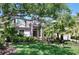 Charming one-story home with lush landscaping and mature trees, creating a serene and inviting curb appeal at 6924 Cumberland Ter, Bradenton, FL 34201