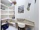 Pantry features custom storage and countertops perfect for organizing your kitchen essentials at 6924 Cumberland Ter, Bradenton, FL 34201