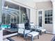 Cozy patio seating area next to a pool and covered outdoor space at 6924 Cumberland Ter, University Park, FL 34201