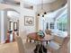 Charming breakfast nook with a round table, comfortable seating, and lots of natural light at 6924 Cumberland Ter, University Park, FL 34201
