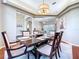 Formal dining room featuring a large table, stylish chairs, and elegant decor at 6924 Cumberland Ter, University Park, FL 34201