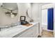 Bathroom featuring dual sinks with marble counters and a tub/shower combo with subway tile at 7016 Dusty Rd, Riverview, FL 33569