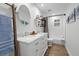 Charming bathroom with double vanity, modern fixtures, and well-lit shower at 7016 Dusty Rd, Riverview, FL 33569