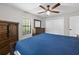Bedroom featuring a rustic wooden bed frame and dresser at 7016 Dusty Rd, Riverview, FL 33569