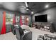 Home theater with reclining seats, bean bag, a large screen, and movie posters at 7016 Dusty Rd, Riverview, FL 33569