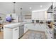 Bright, updated kitchen with granite countertops, stainless steel appliances, and custom cabinetry at 7016 Dusty Rd, Riverview, FL 33569