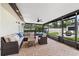 Covered patio with comfortable seating and outdoor lighting, perfect for relaxing at 7016 Dusty Rd, Riverview, FL 33569