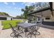 Outdoor patio with brick flooring and outdoor dining set near screened lanai and sprawling backyard at 7016 Dusty Rd, Riverview, FL 33569