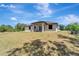 The backyard features lush green space, perfect for recreation, and beautiful landscaping at 8123 Wawana Rd, North Port, FL 34287