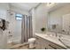 This bathroom features a shower and tub combination and a quartz countertop vanity at 8123 Wawana Rd, North Port, FL 34287