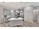 Modern kitchen with stainless appliances, quartz countertops, and a center island with seating at 8123 Wawana Rd, North Port, FL 34287