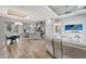 Open-concept living space with hardwood floors, a comfortable sofa, and view to the kitchen at 8123 Wawana Rd, North Port, FL 34287